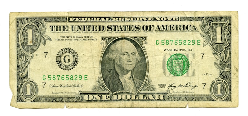 Close-up of a US dollar bill's reverse side showing the Great Seal eagle and intricate engraving detail that collectors examine